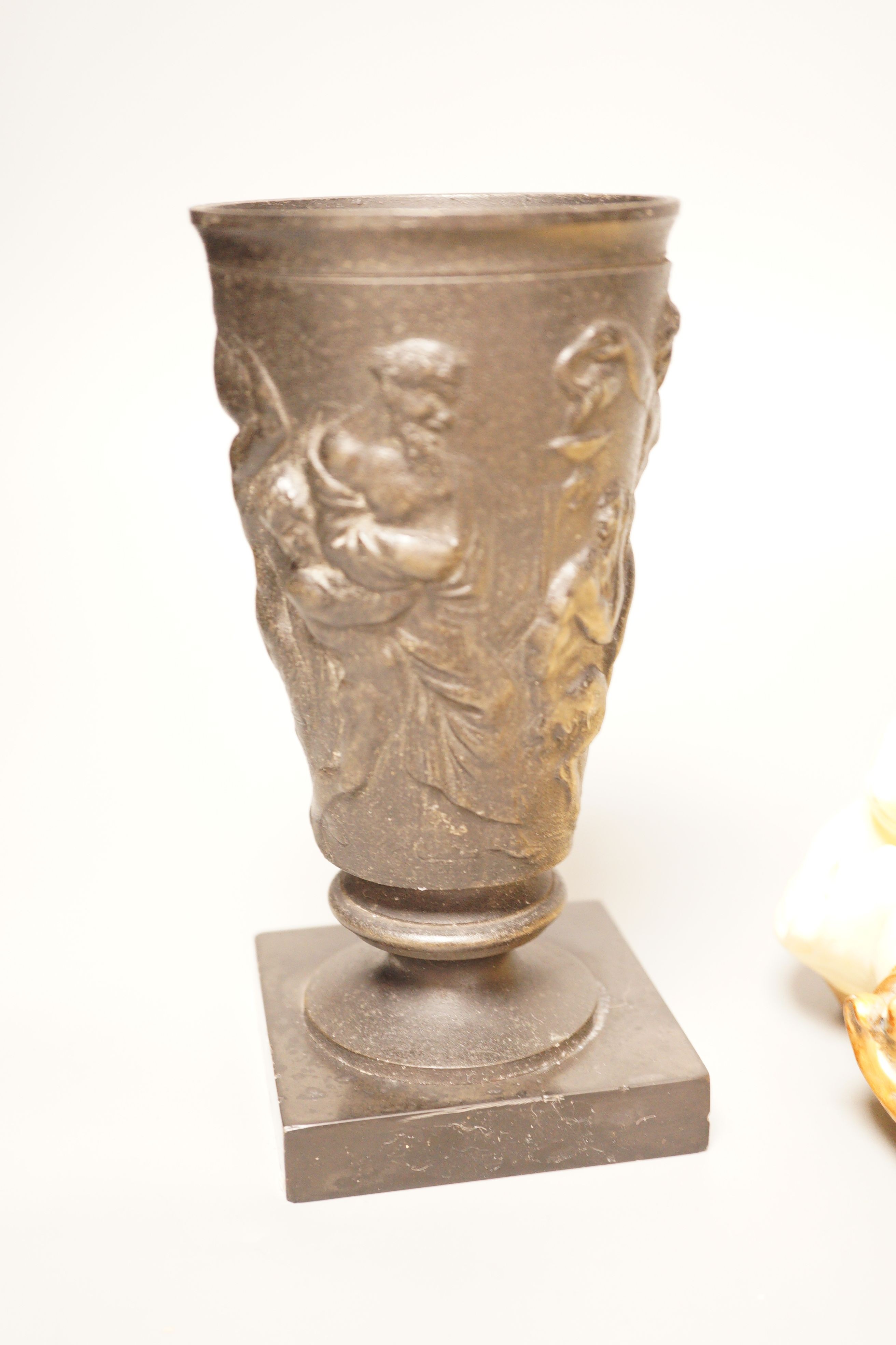 A pair of gilt resin figural wall appliques, signed, and a 19th century cast iron and slate beaker, Sotheby’s label to base, tallest 17cm